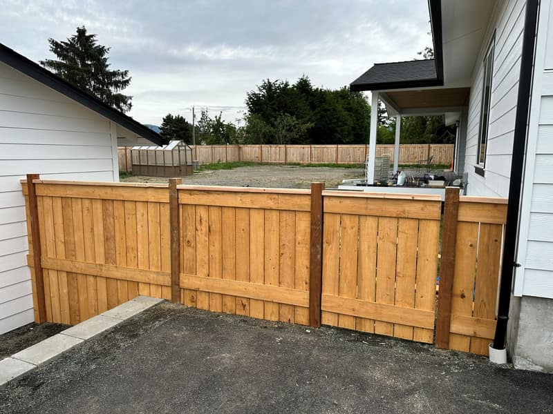 New-build cedar privacy fence along a residential property line — Port Angeles, WA