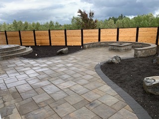 Backyard patio with built-in firepit + cedar privacy fence